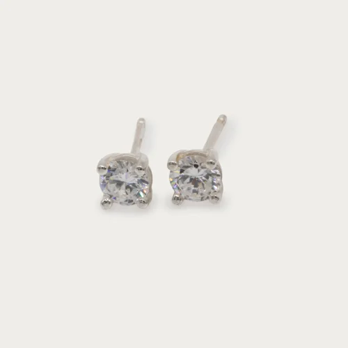Pendientes dormilona de oro blanco 18k con diamantes talla brillante de 0.35ct cada uno en cuatro garras